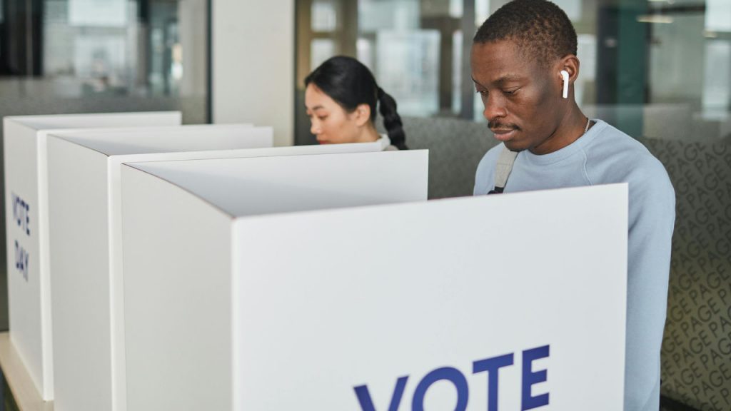 Man and woman at voting booth