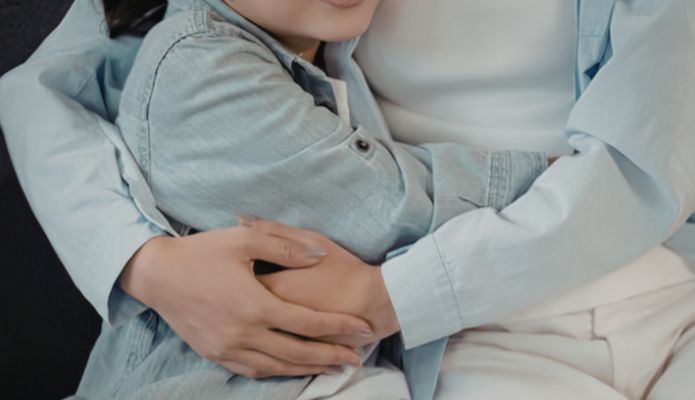 Woman and child hugging