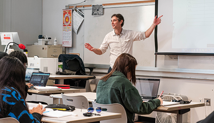 Teacher explaining to his classroom