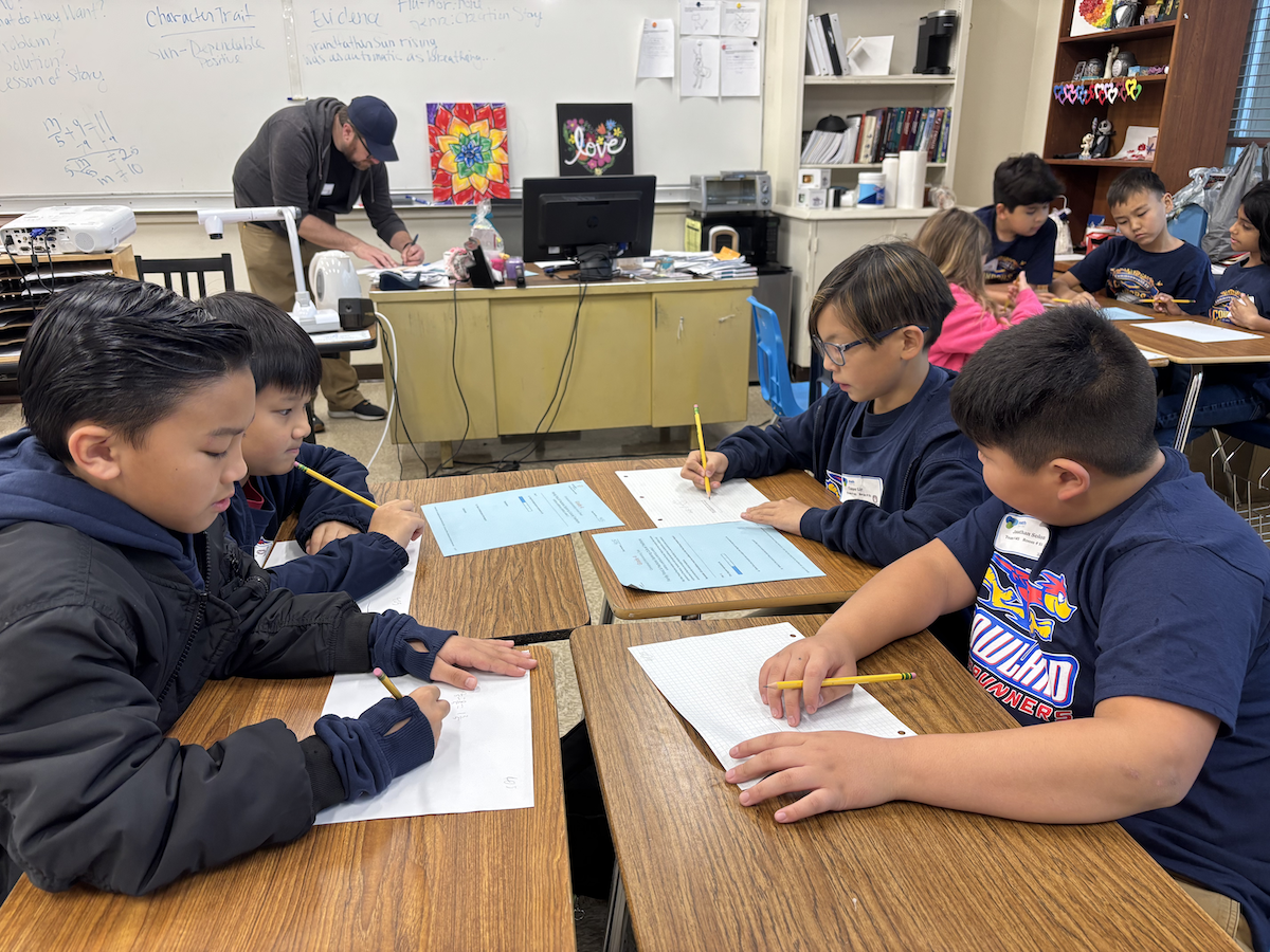 Students sitting in a group at their desks