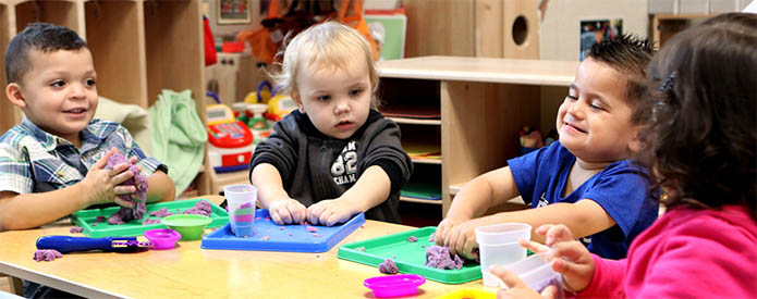 children making things at a table