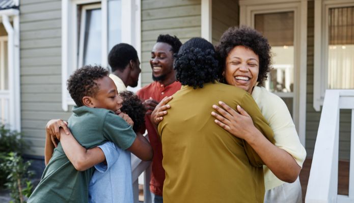 A family hugging and embracing one another