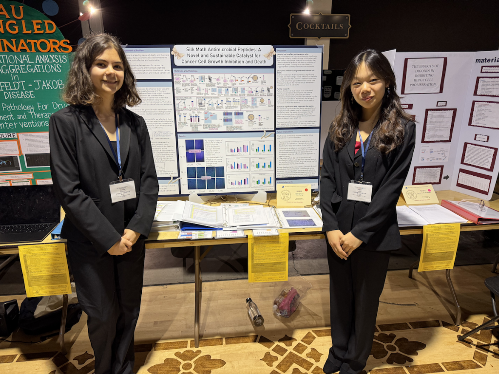 Students in front of science fair project
