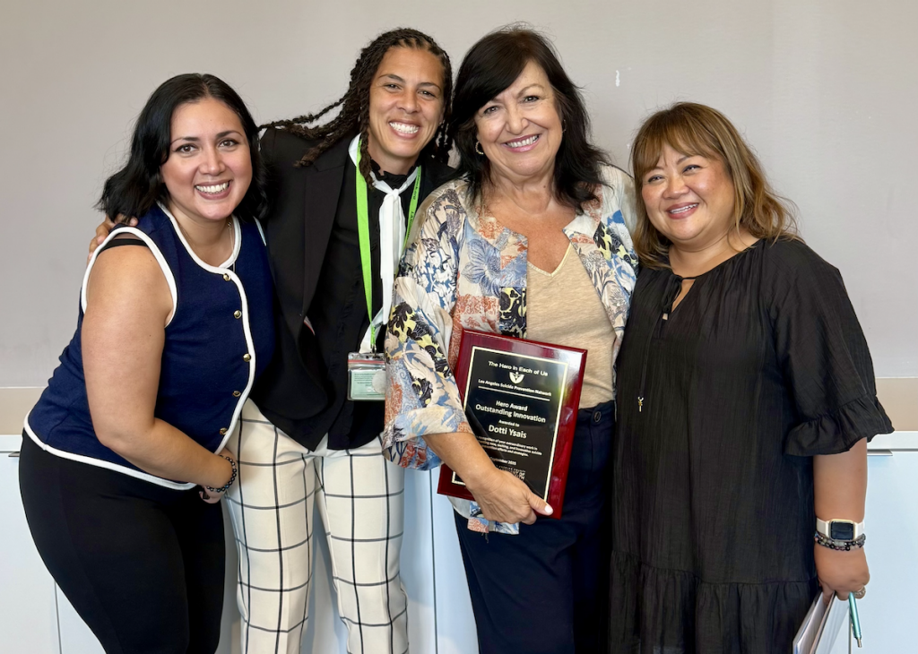 Group of LACOE staff members with 2025 LASPN Hero Award winner Dotti Ysais