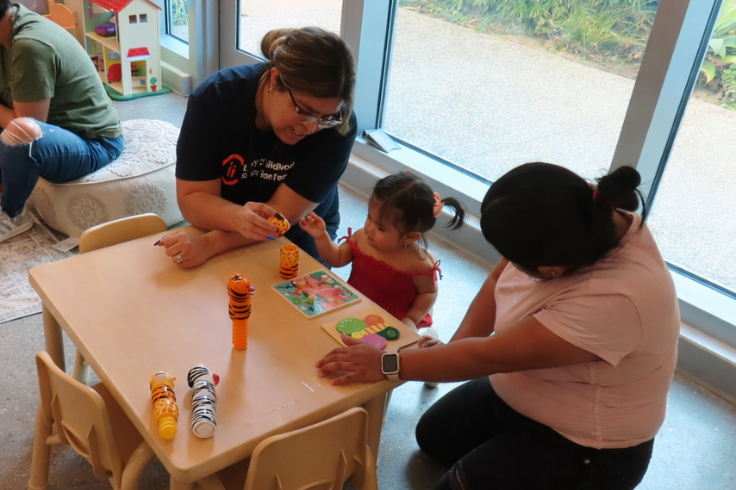 Teacher working with a student and parent