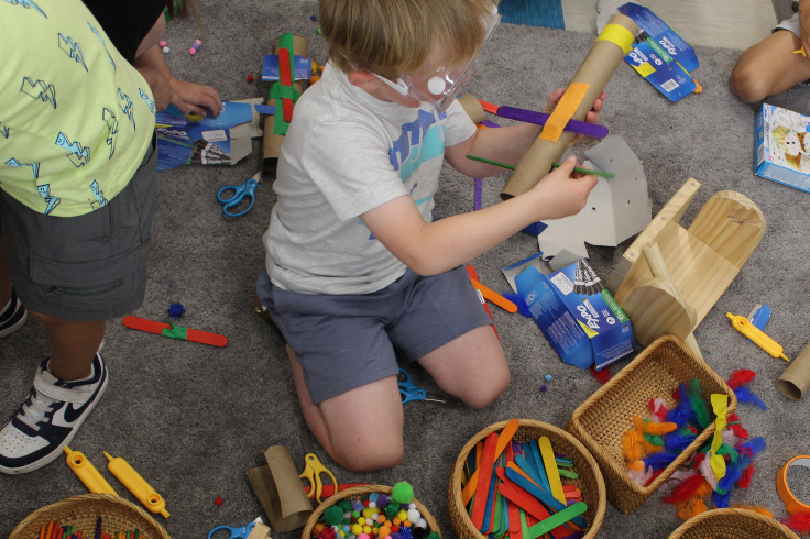Student playing in model classroom