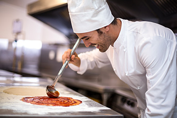 chef making pizza