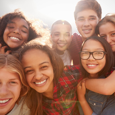 Students posing for a photo on a sunny day