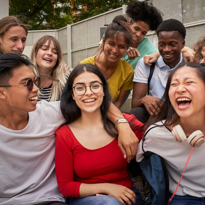 Students laughing on steps at school