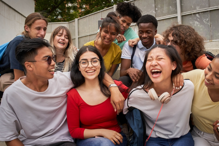 Students laughing on steps at school