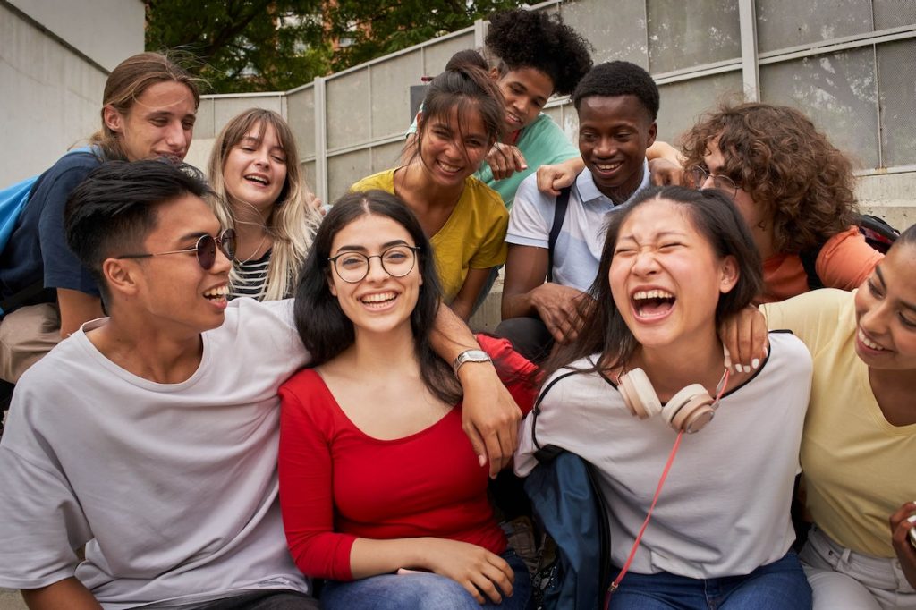 Group of students laughing on steps