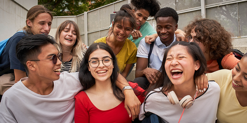 Group of students laughing on steps