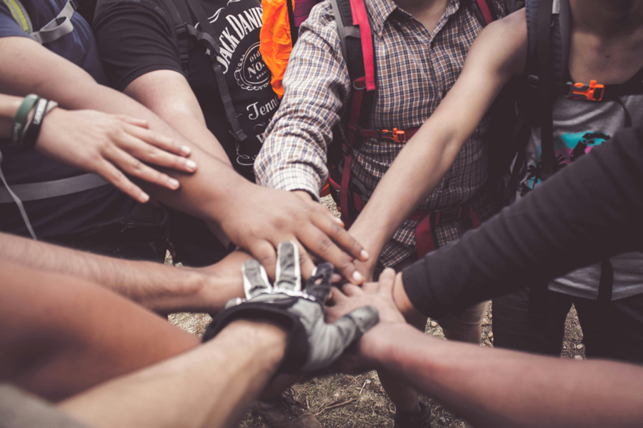 Hands stacked on top of one another as show of support