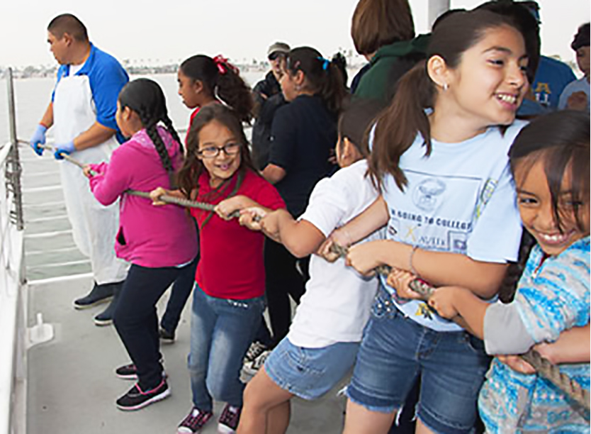 Young students participating in outdoor marine science event