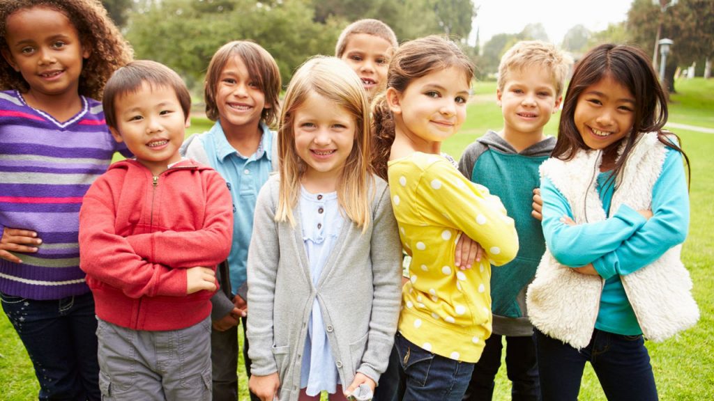 Eight children standing outside at park