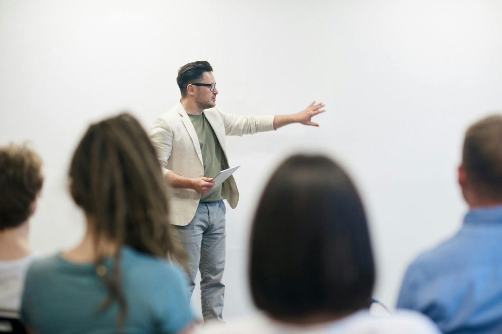 Male teacher lecturing in class