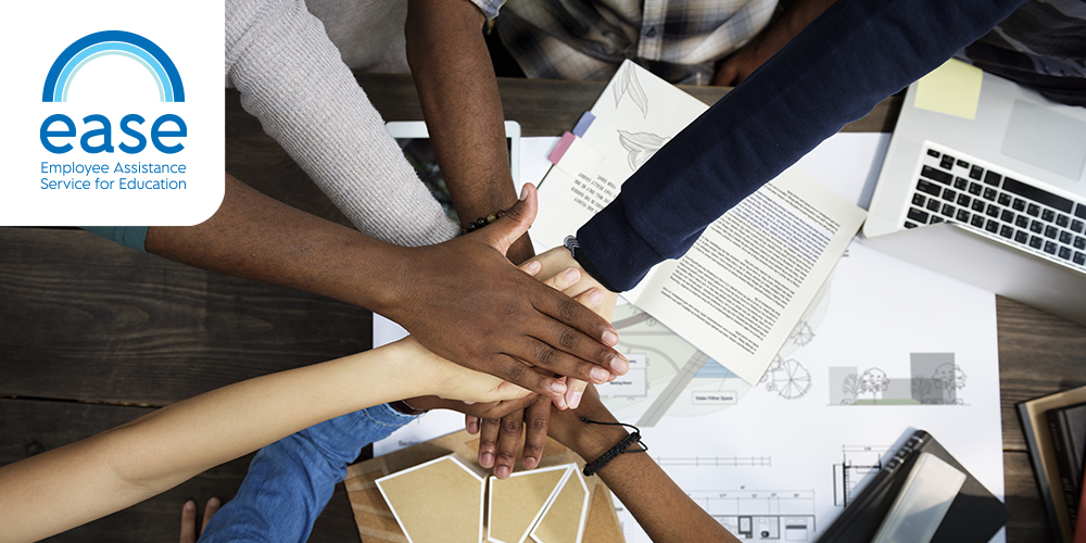 Hands-in huddle