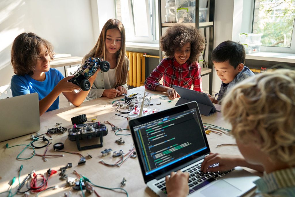 Students working with robotics and coding